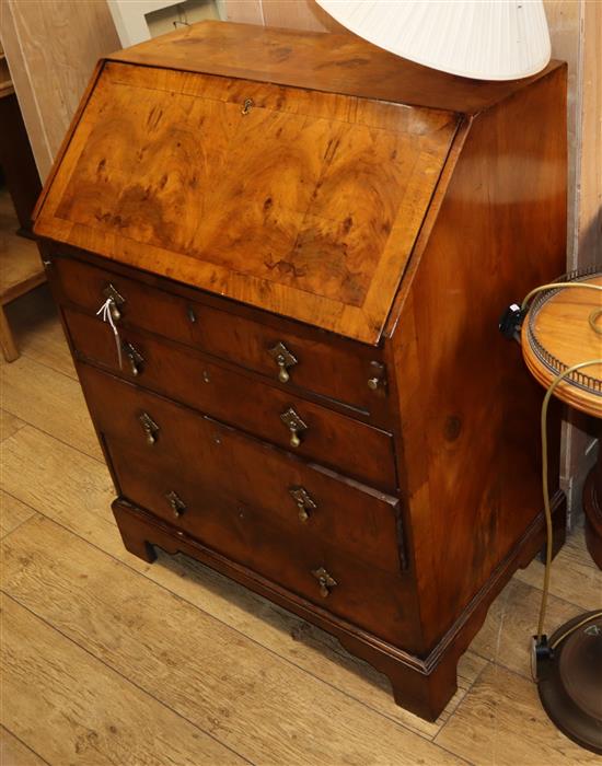 An early 20th century George II design banded walnut bureau W.76cm